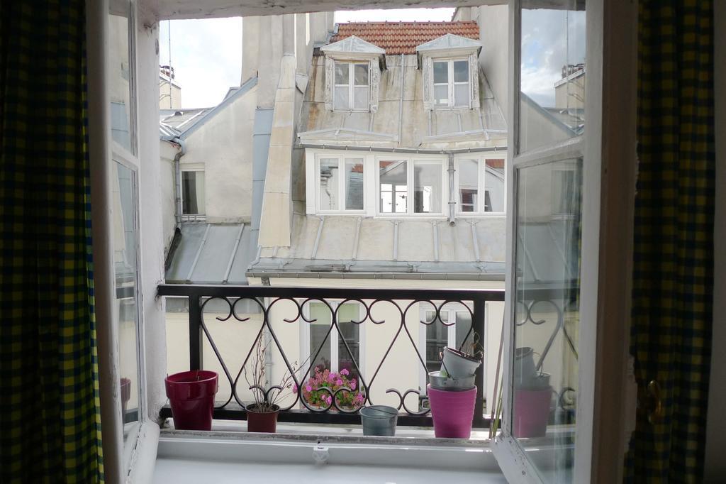 Appartamento Le Jardin Du Marais Parigi Camera foto